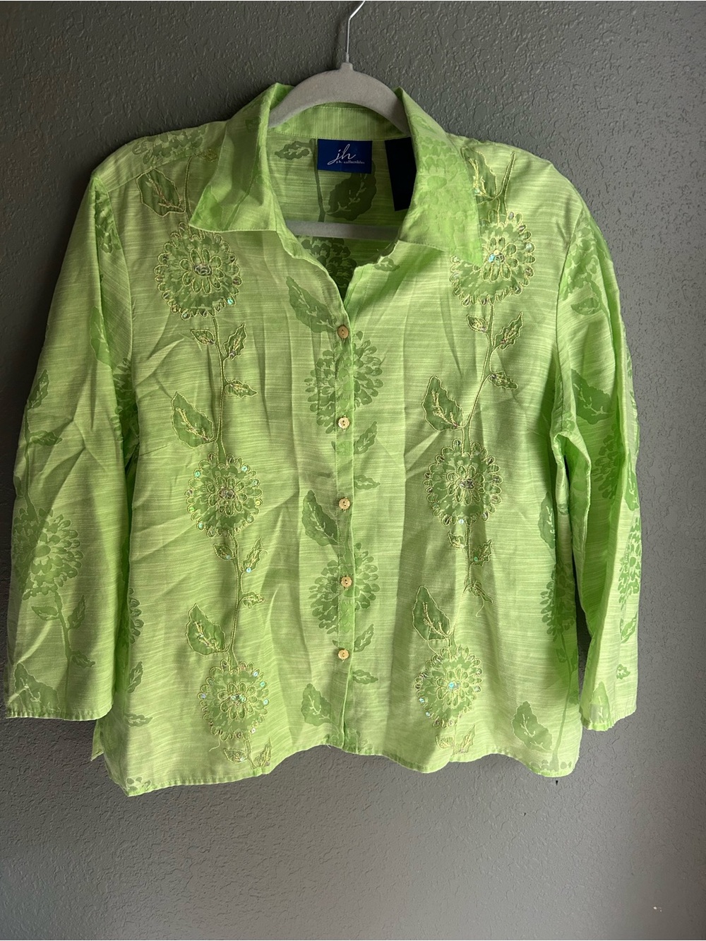 Green floral button-up blouse